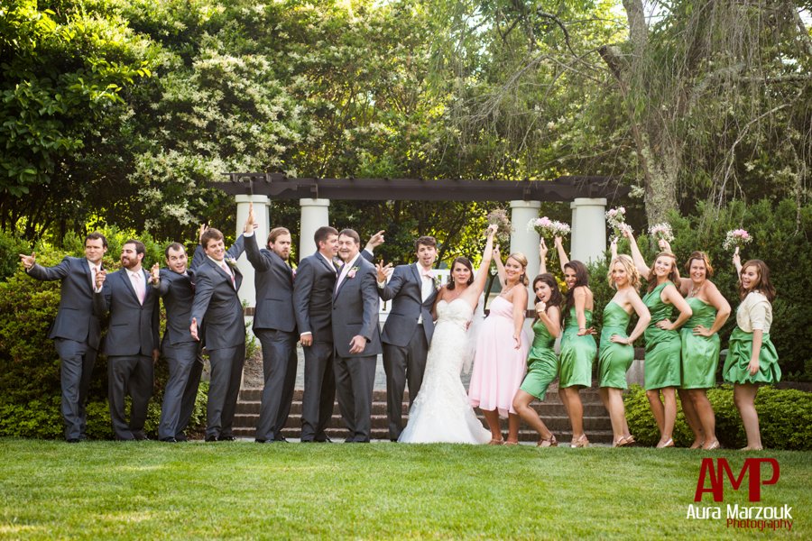 Grey tuxes and green bridesmaid dresses in this wedding party image by Aura Marzouk Photography.