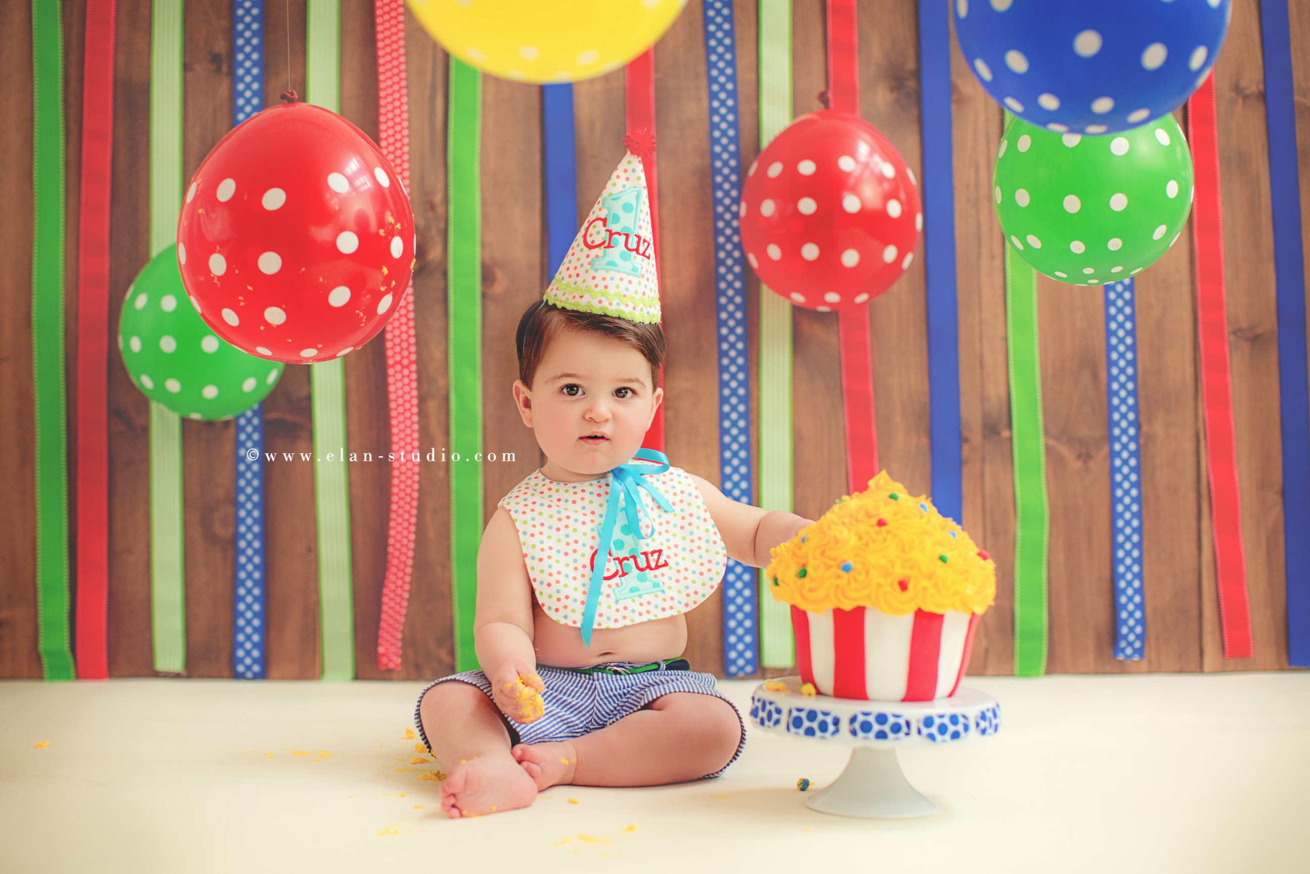 first birthday circus theme cake smash with balloons