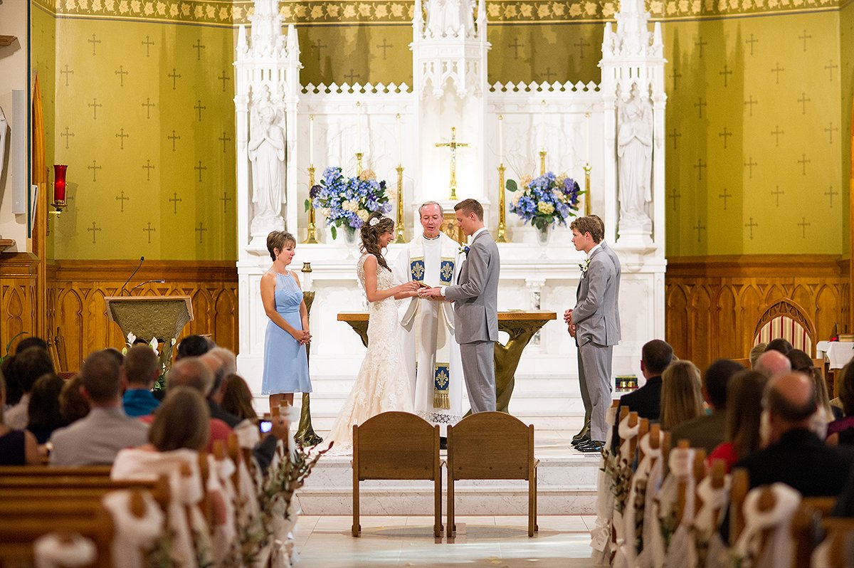 exchanging rings during church ceremony