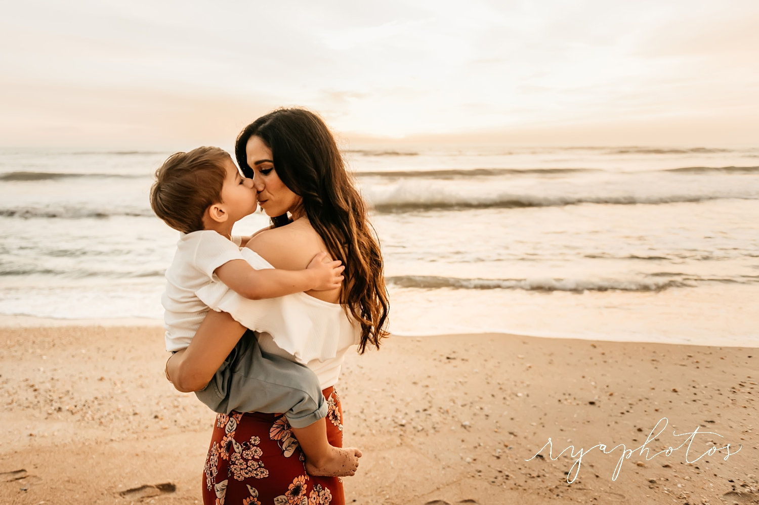 toddler kissing mom's nose, sunrise beach family session, Florida, Ryaphotos