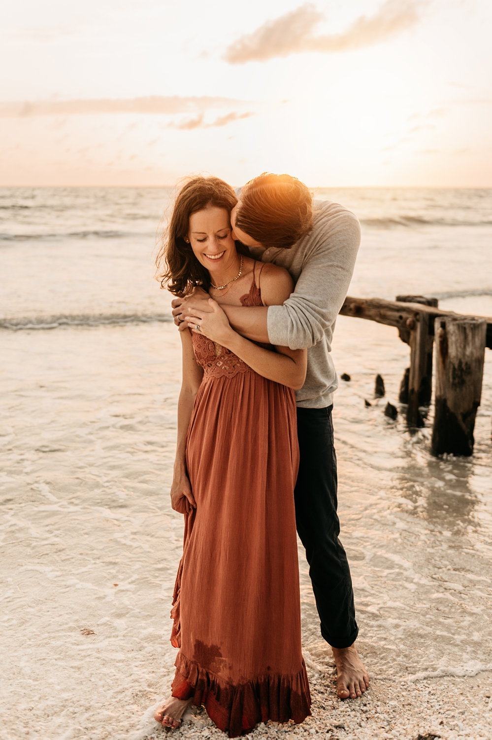 married couple standing on a beach, Naples Beach, Florida, Rya Duncklee