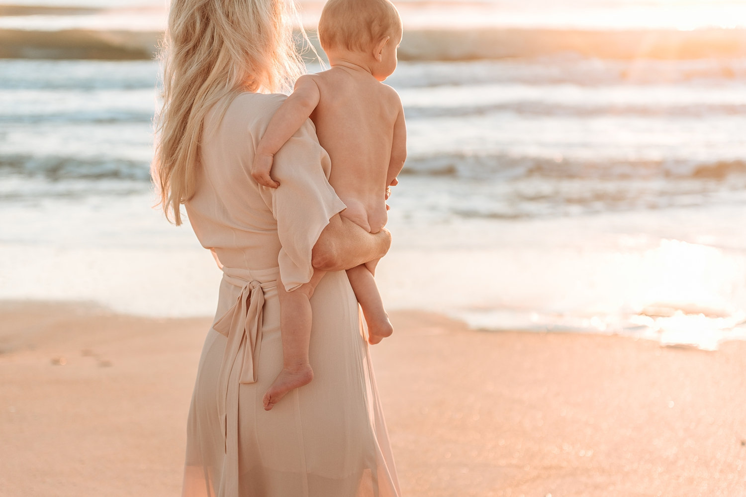 mom and baby boy looking out at the ocean, Jacksonville photographer, Ryaphotos