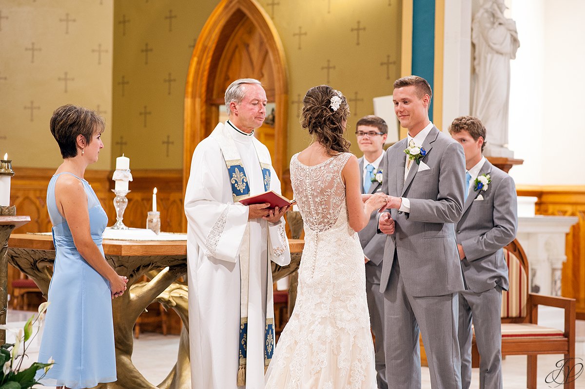 exchanging rings during church ceremony