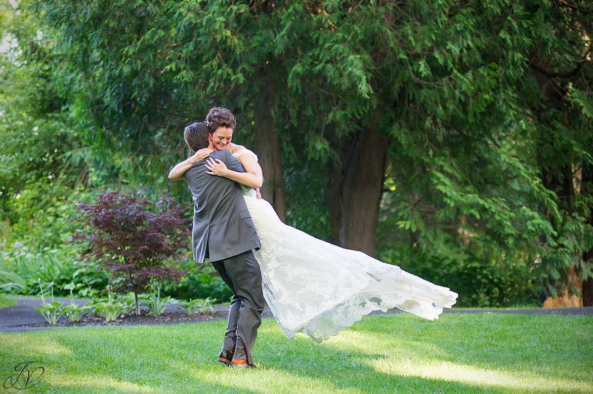 fun photo of groom spinning bride