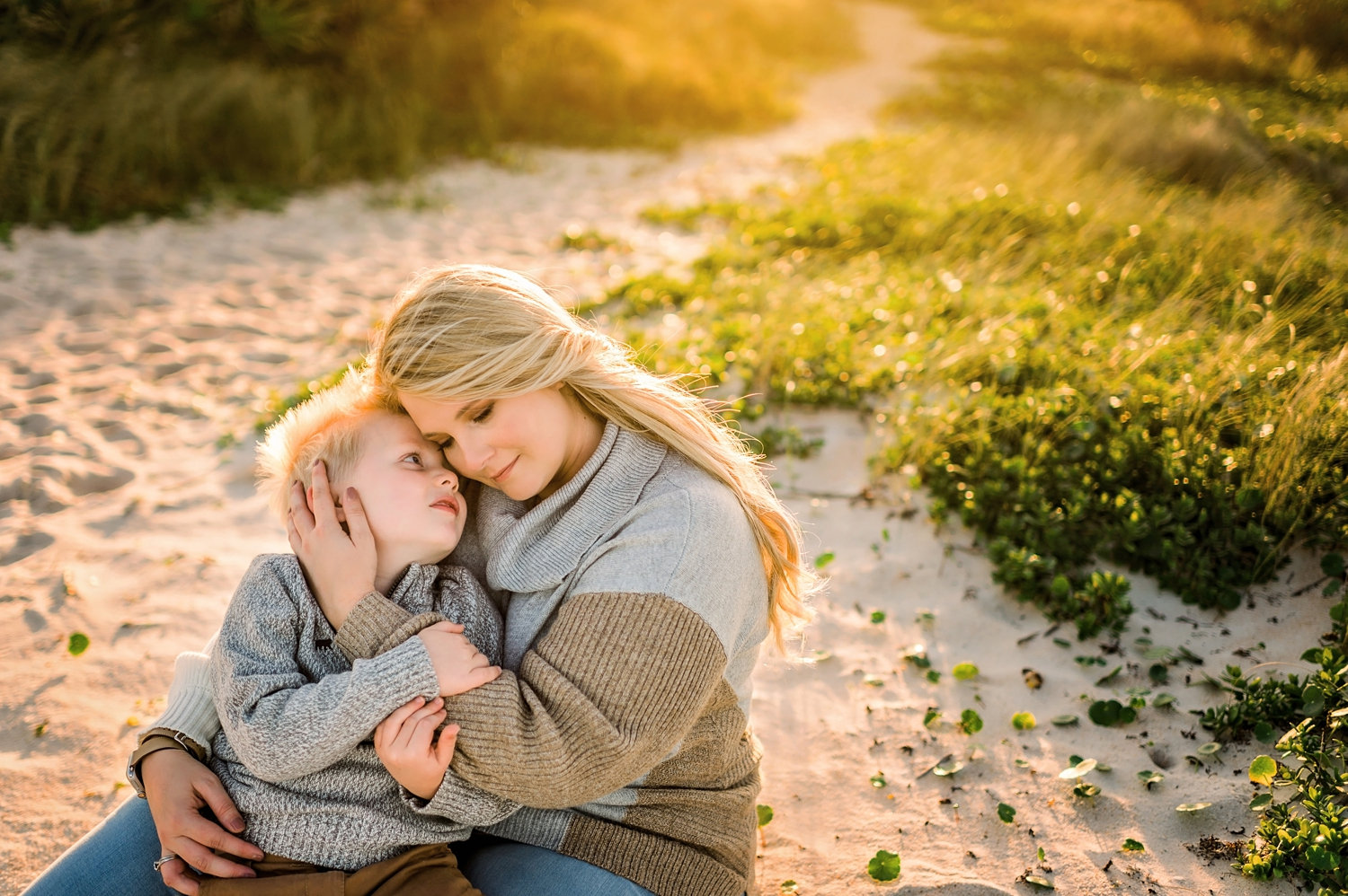 mother and son sitting on sandy beach path, Saint Augustine Beach, Rya Duncklee