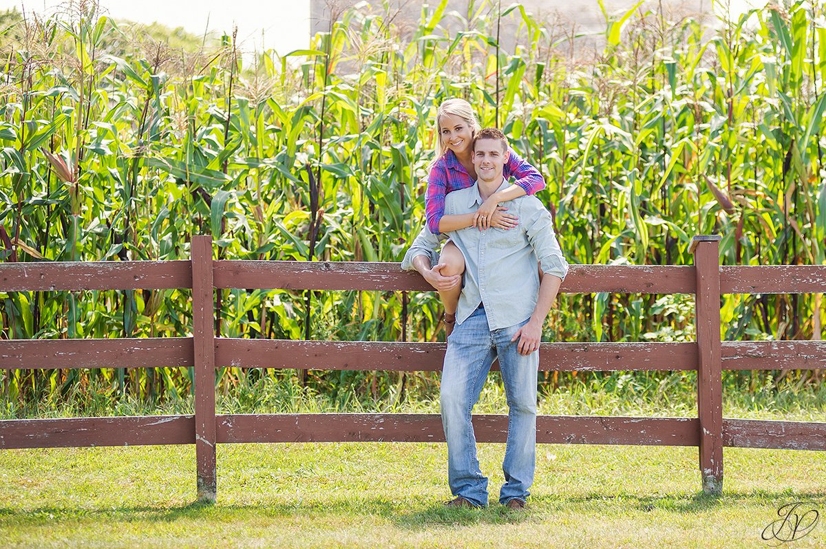 cute engagement photo in front of cornfield
