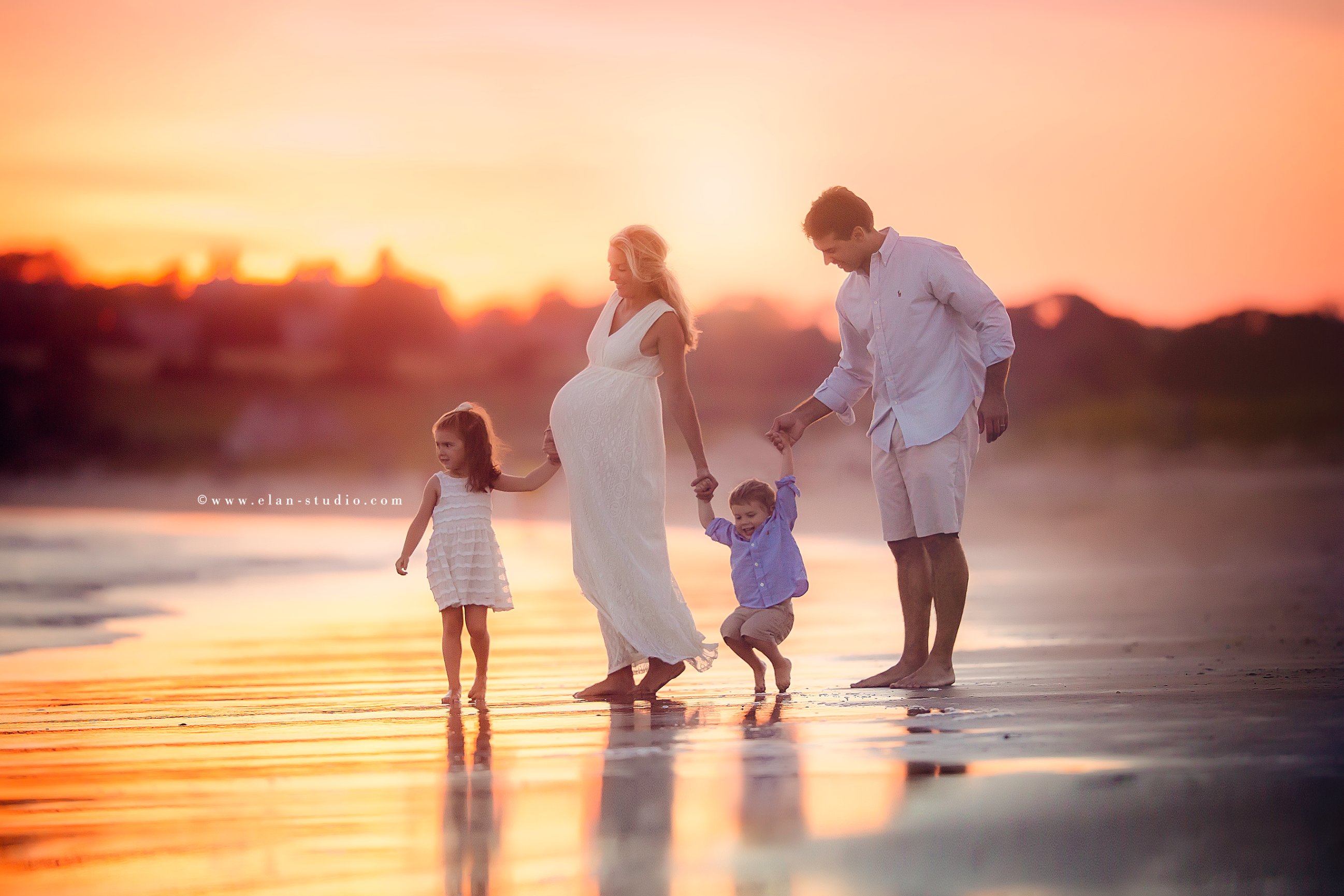 family of four on the beach