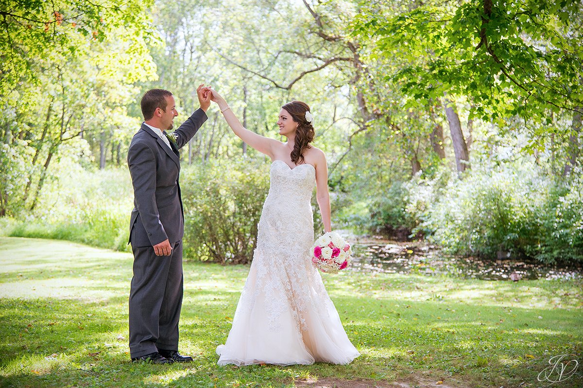 romantic photo of groom twirling his bride