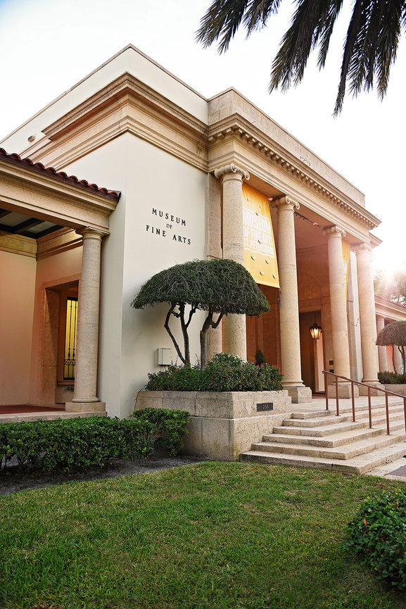 Entrance of the Museum of Fine Arts featuring classic architecture and well-manicured landscaping.