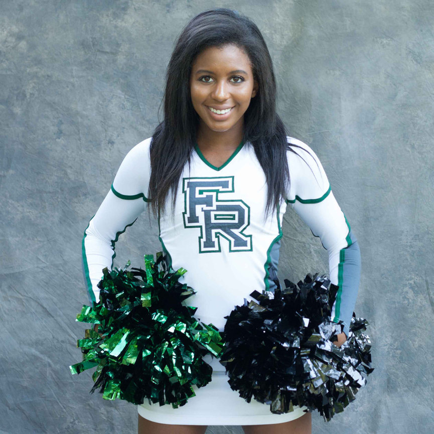 High school senior in her cheer uniform during a custom portrait session. Celebrating school spirit, confidence, and senior year milestone. Portrait experience for Colorado families, Fort Collins, Denver, Colorado Springs and Mountain Destinations
