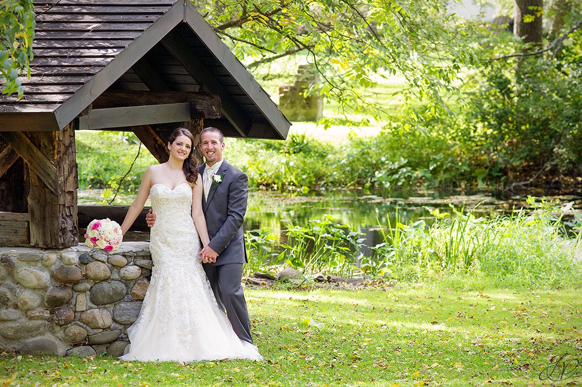 adorable photo of bride and groom near a wishing well