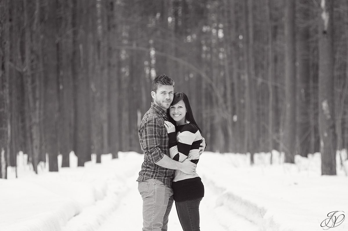 romantic black and white photo of engaged couple in winter