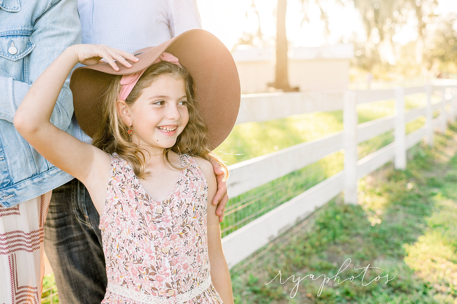 little girl wearing hat, mom and dad, rustic family photo session, Ryaphotos