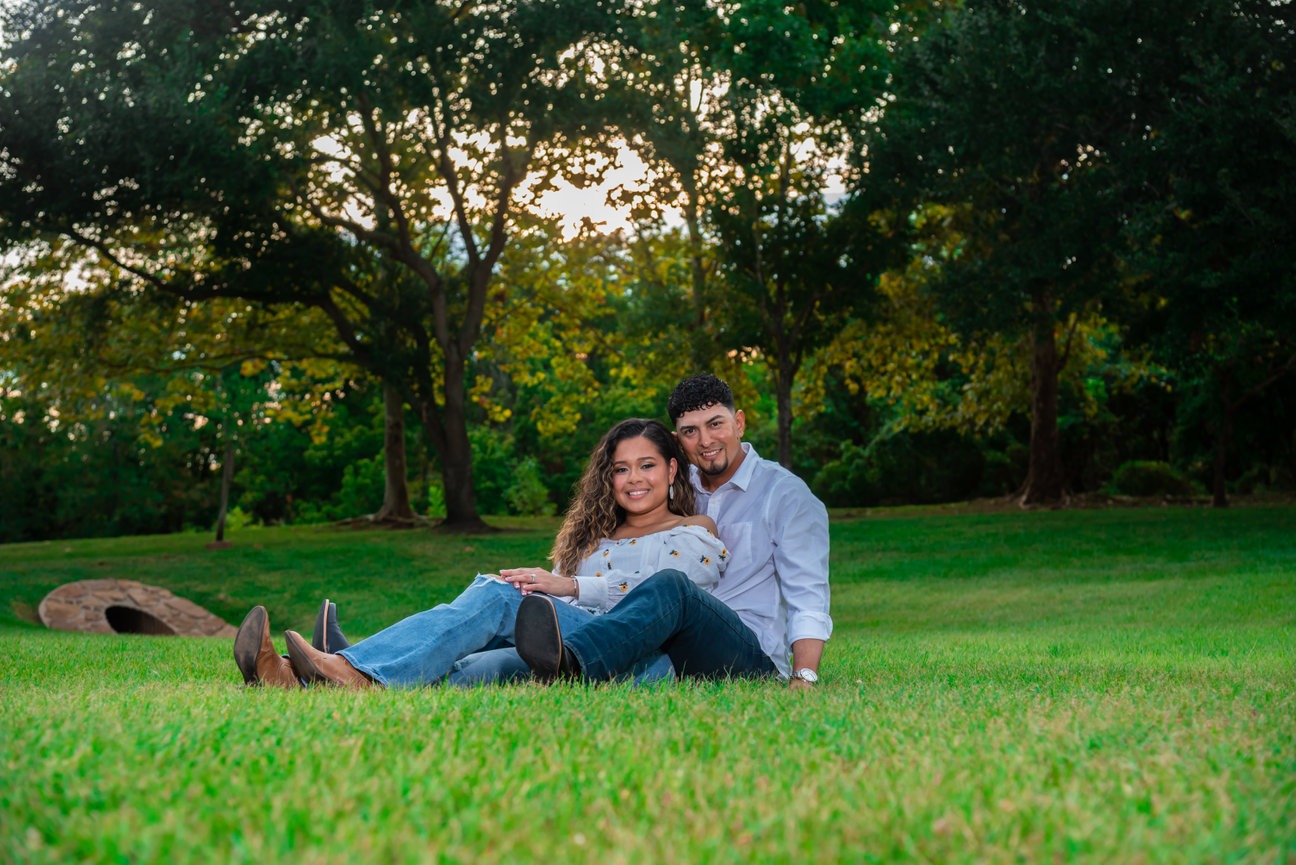 Couple sitting on grass in a park