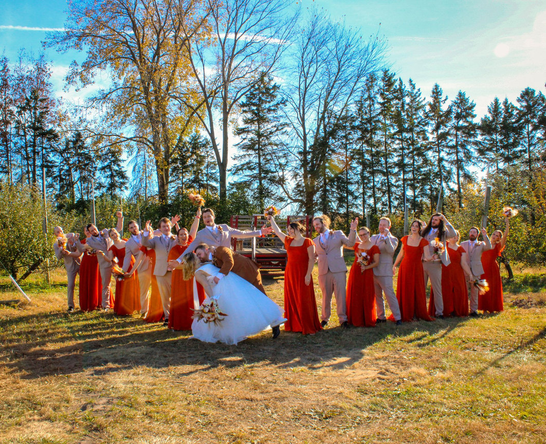 Wedding party in colorful dresses outdoors