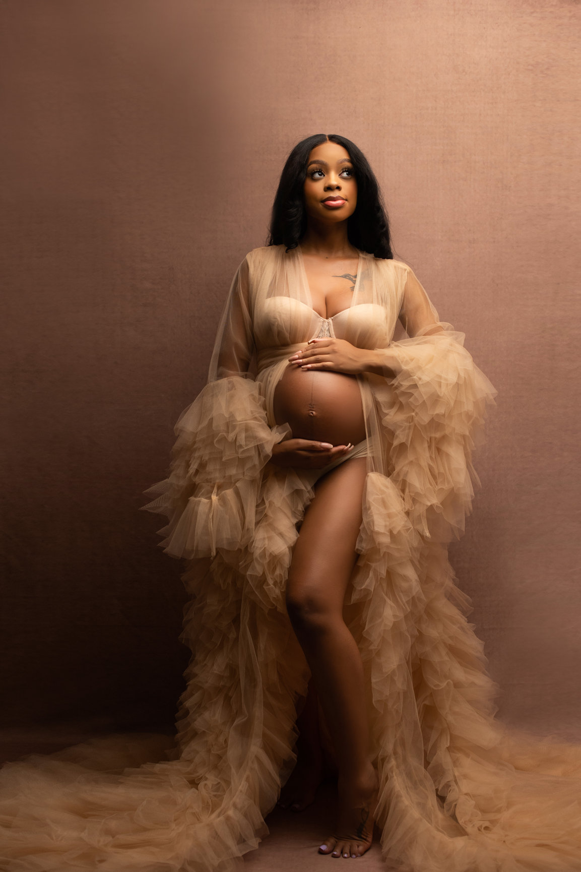 Maternity portrait in a tulle robe