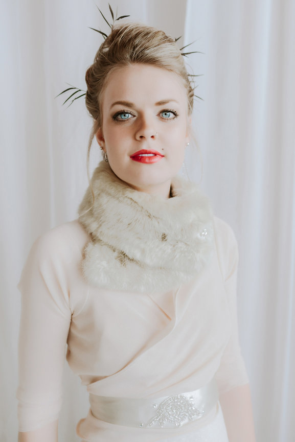 Natural light and white dress and backdrop for stunning studio portrait of client with bold red lipstick, taken in a photo studio with Adam Trujillo, a Las Vegas portrait photographer.