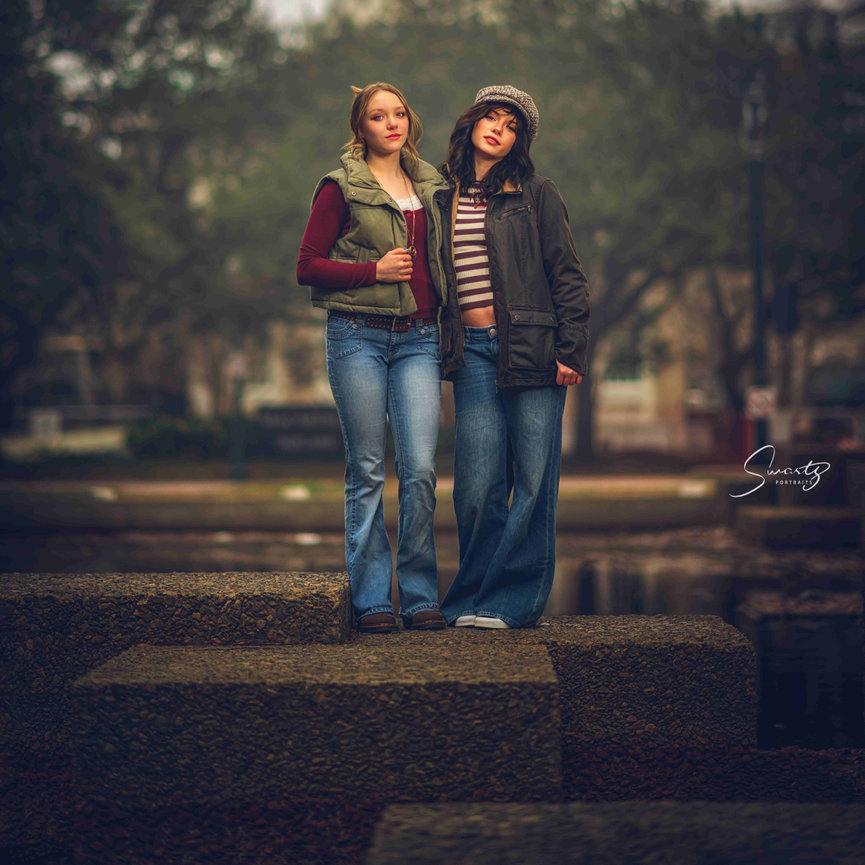 Senior portrait of two sisters in fashion-forward outfits in Downtown Norfolk
