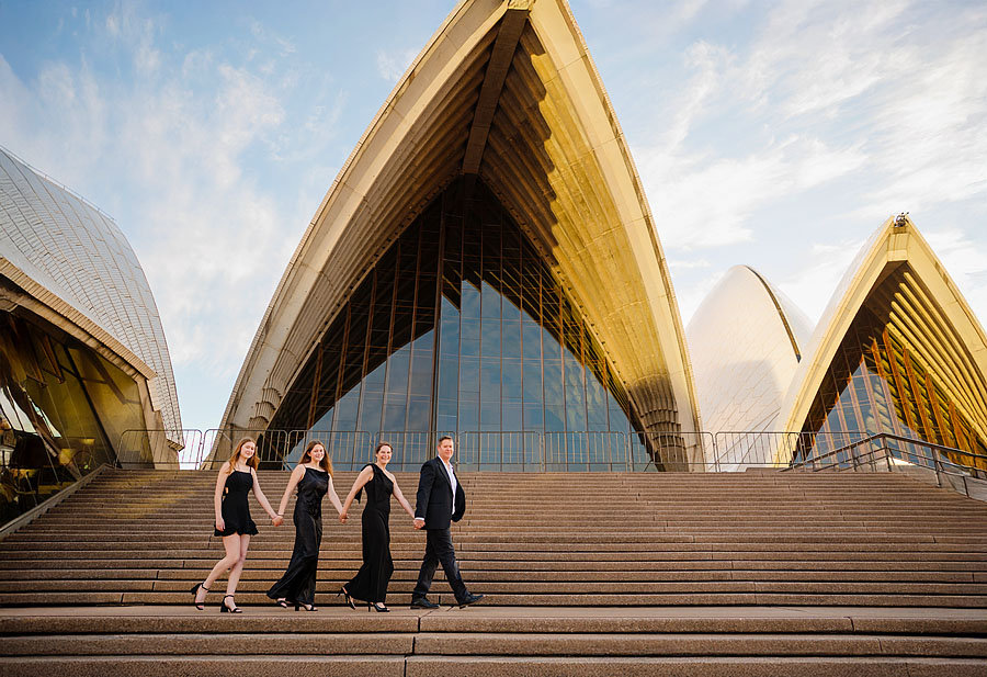 Portrait of a couple on the steps of the Opera House during a Sydney Opera House Photoshoot with Sarah Iris Photography