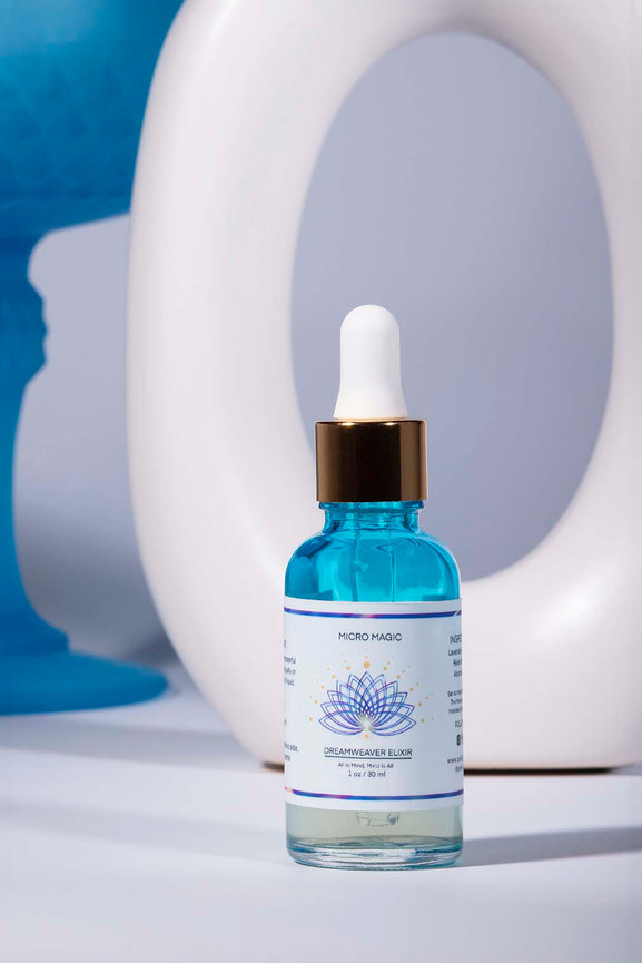 Blue glass dropper bottle with arches