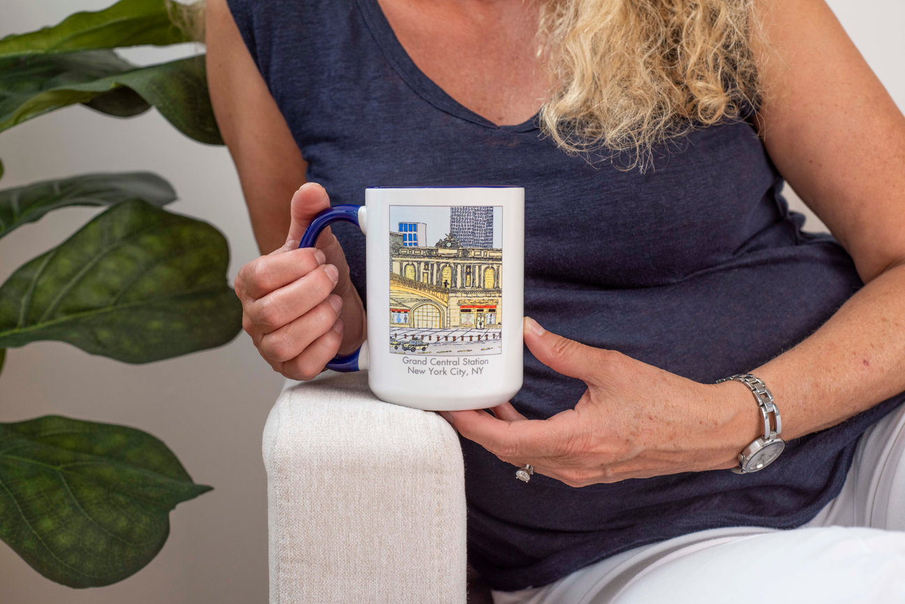 Woman holding mug sitting on a couch