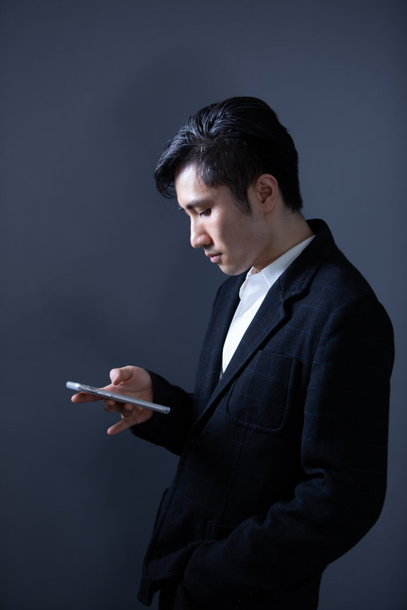 dramatic business executive profile with cellphone