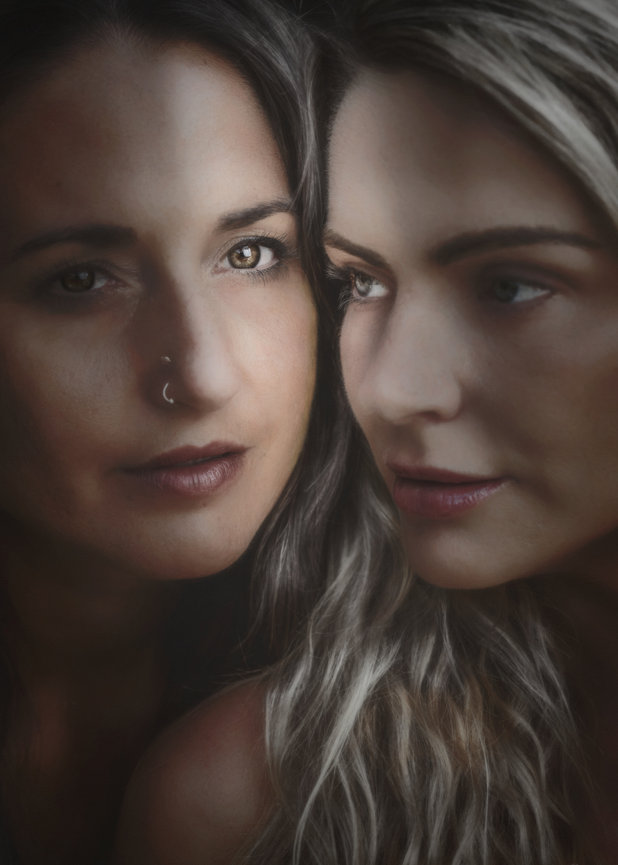 Close up Fine Art Painterly Portrait of two women face to face, softly lit with dramatic shadows