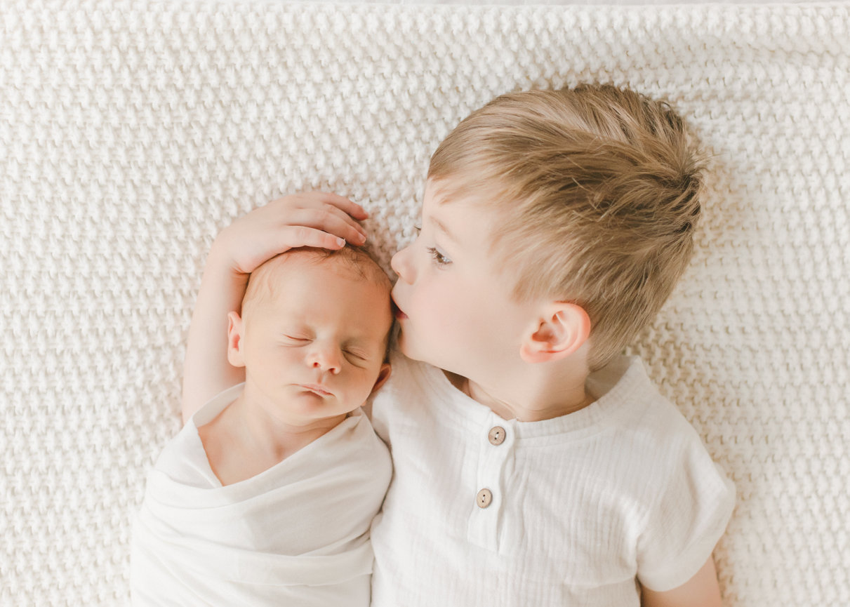 Siblings during a newborn photo session in Minneapolis