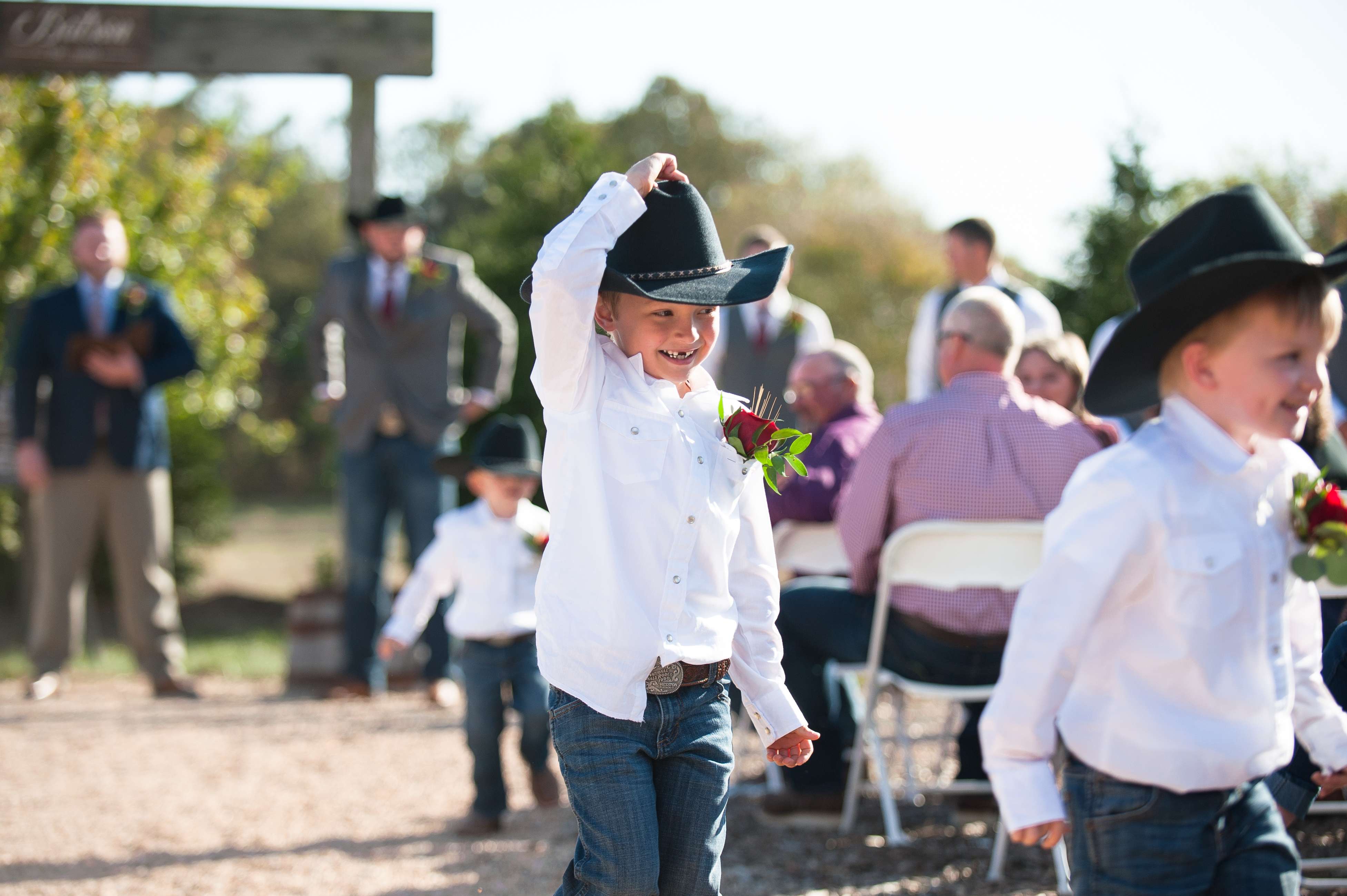 Ringbearers hugging the groom at a wedding near Springfield, Missouri.