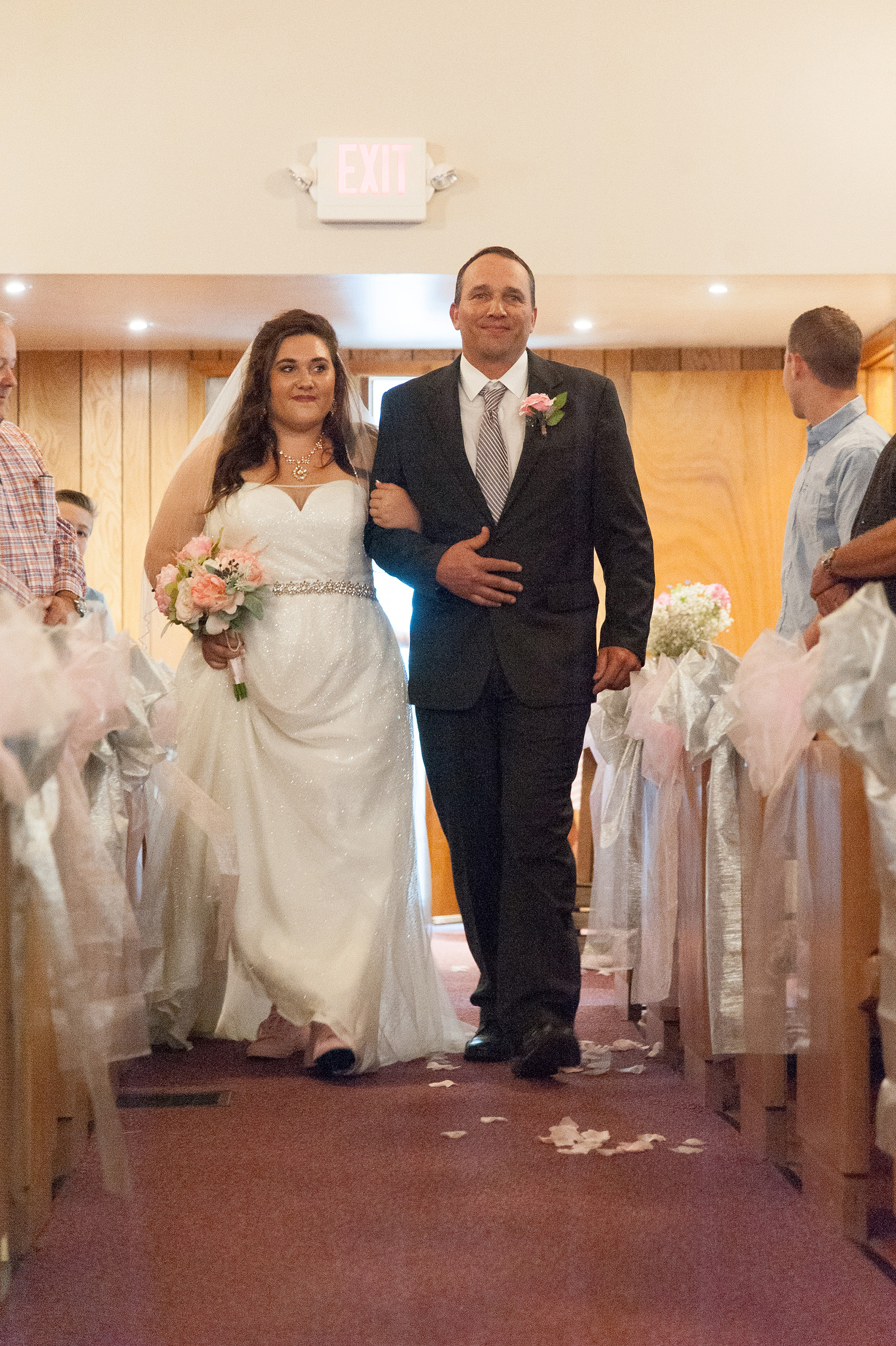 Father walking daughter down the aisle