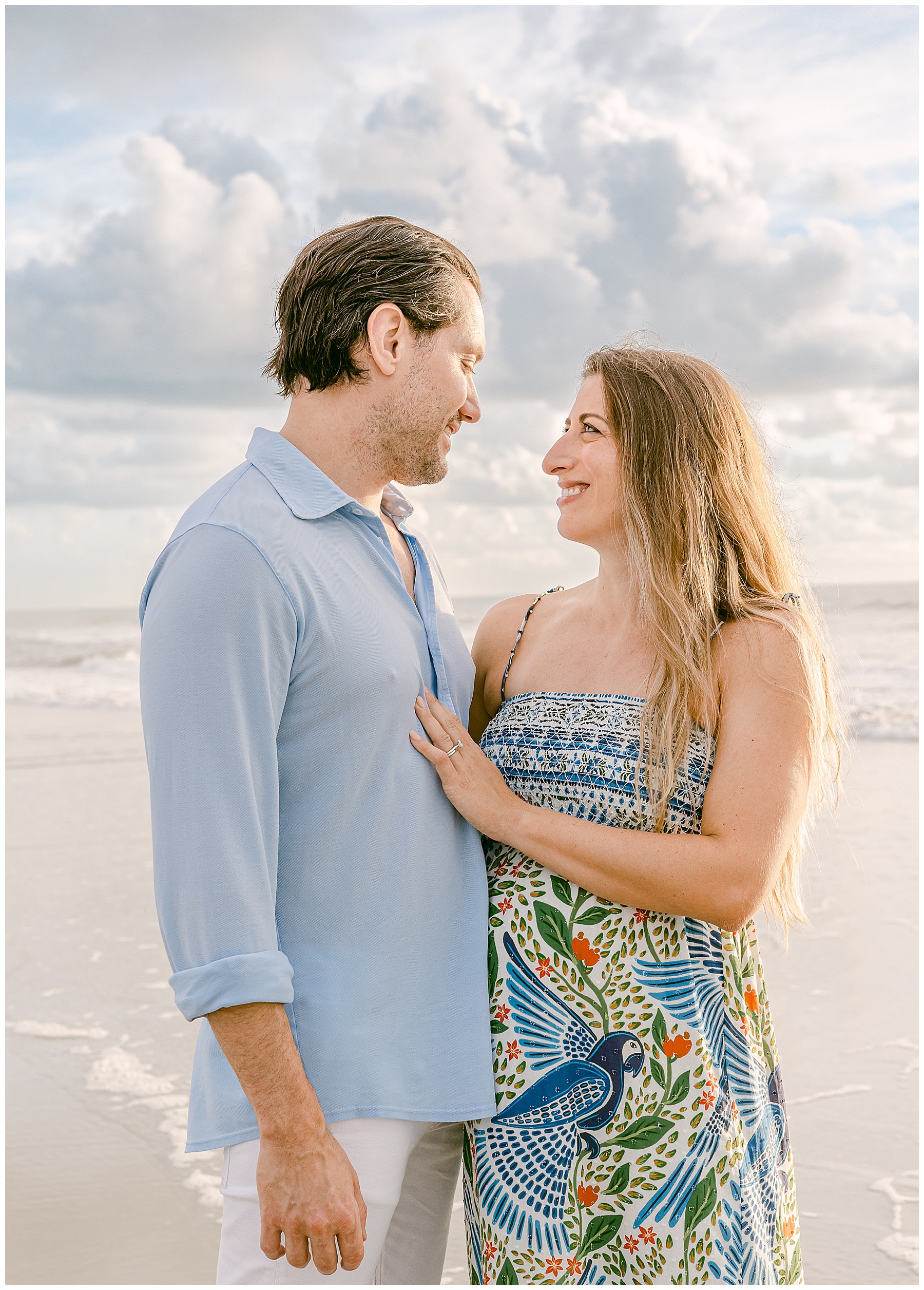 light and airy maternity portrait of couple in saint augustine beach at sunrise