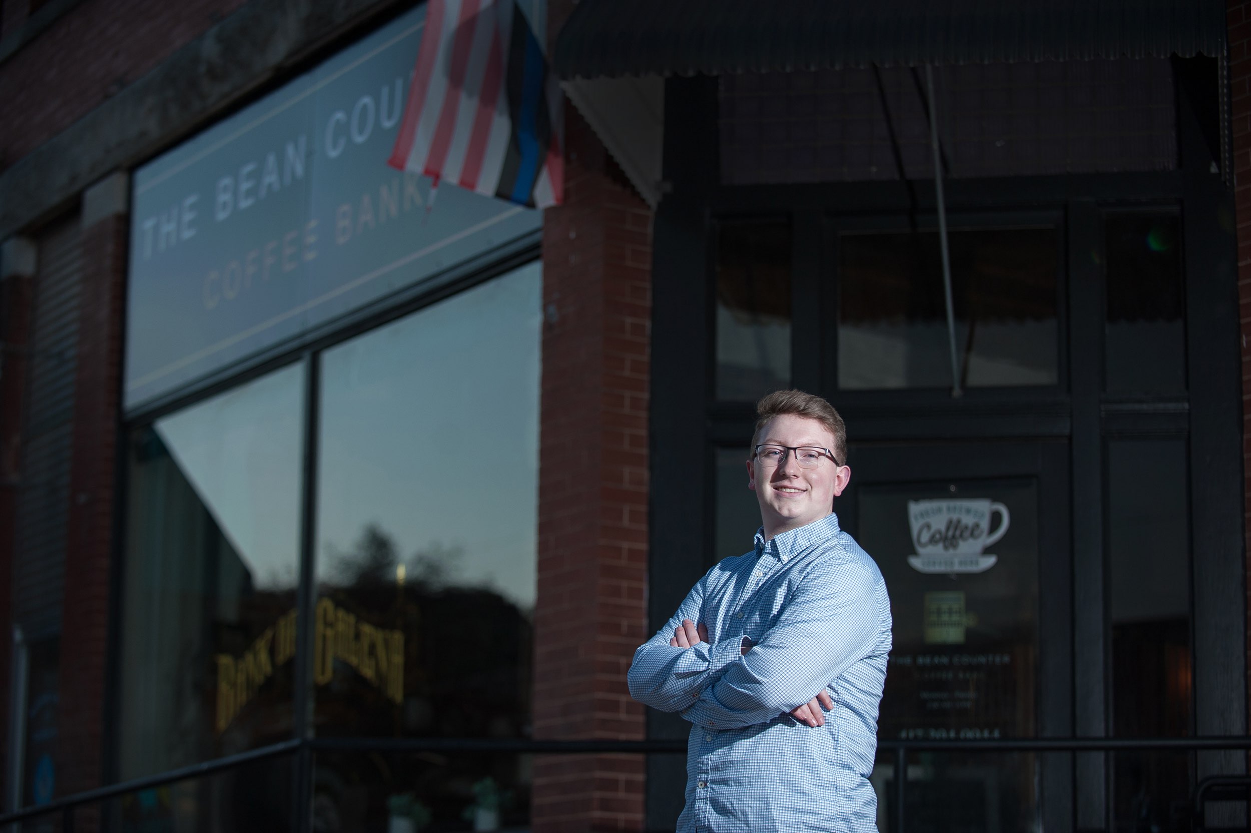 Senior guy standing in front of a Galena MO coffee shop.