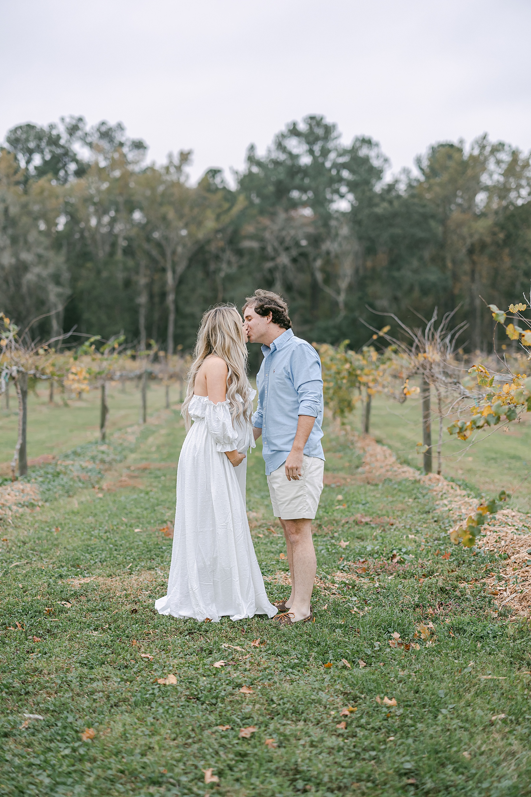 couple standing together in vineyard at Congaree and Penn Farm