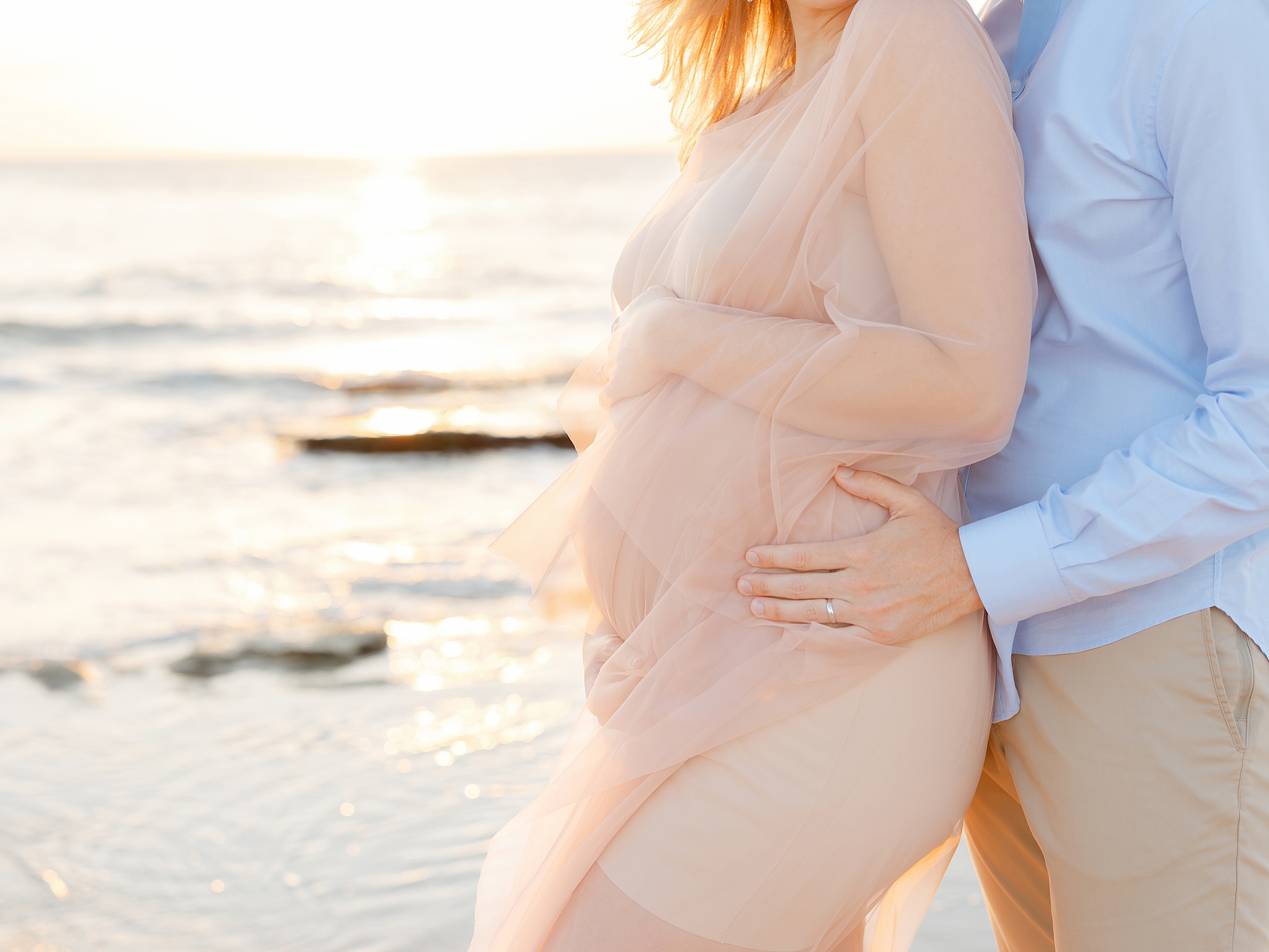 St. Augustine sunrise maternity session on the beach during an airy sunrise.