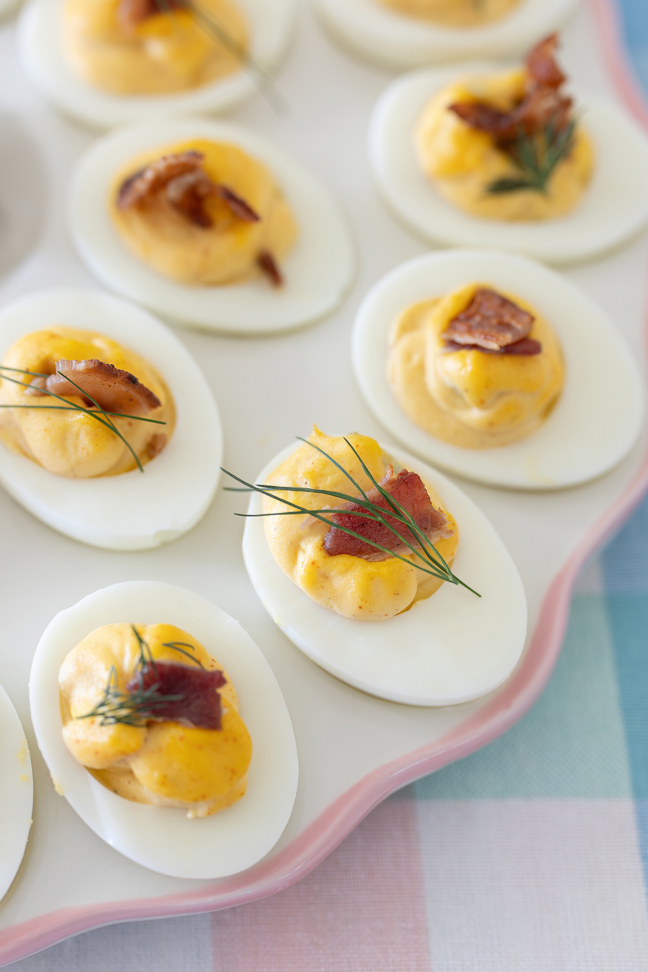Deviled eggs on a pastel plate.