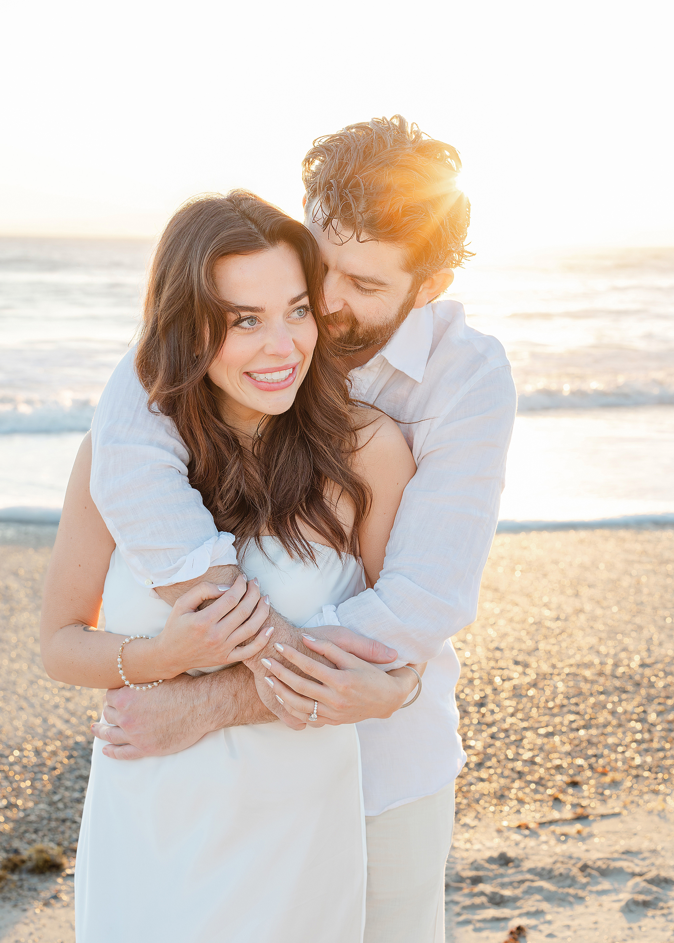 A sunrise wedding portrait of a man and woman on the beach at the Omni Resort, Amelia Island.