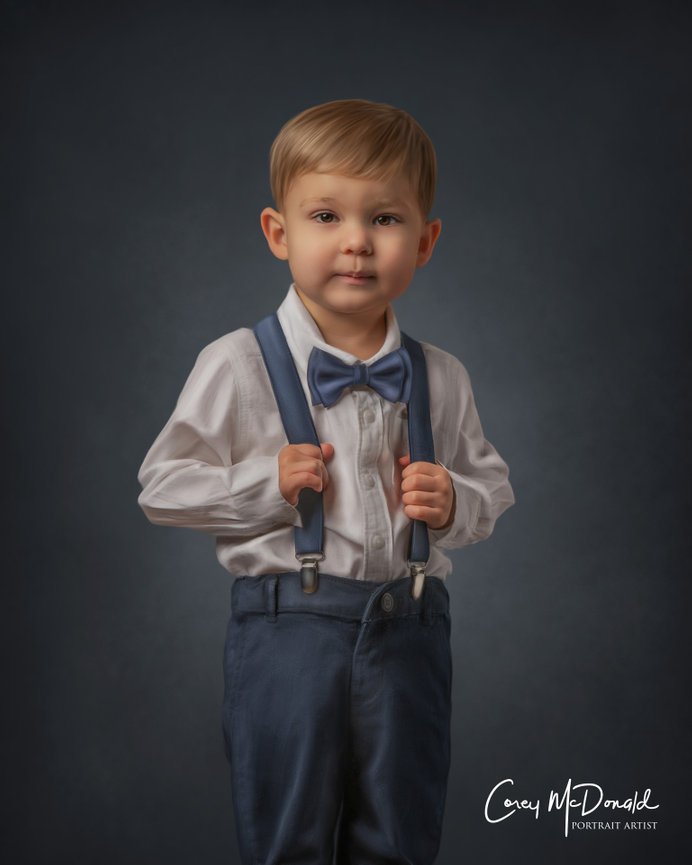 Young child in formal attire with a bow tie and suspenders against a dark background.