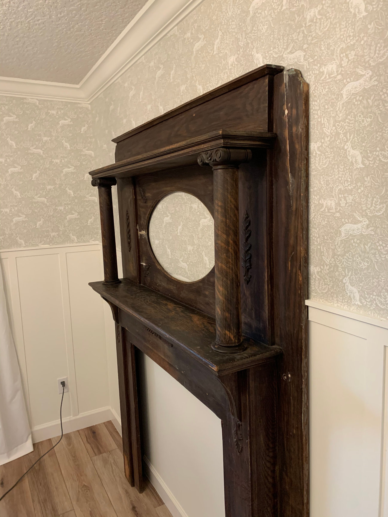 side angle view of Victorian fireplace restoration in progress