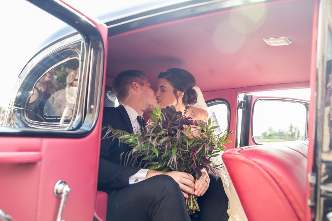 An editorial bridal portrait captured amidst the UNESCO World Heritage pastel facades of St. George’s, showcasing the vibrant historic charm and British-colonial architecture of Bermuda.