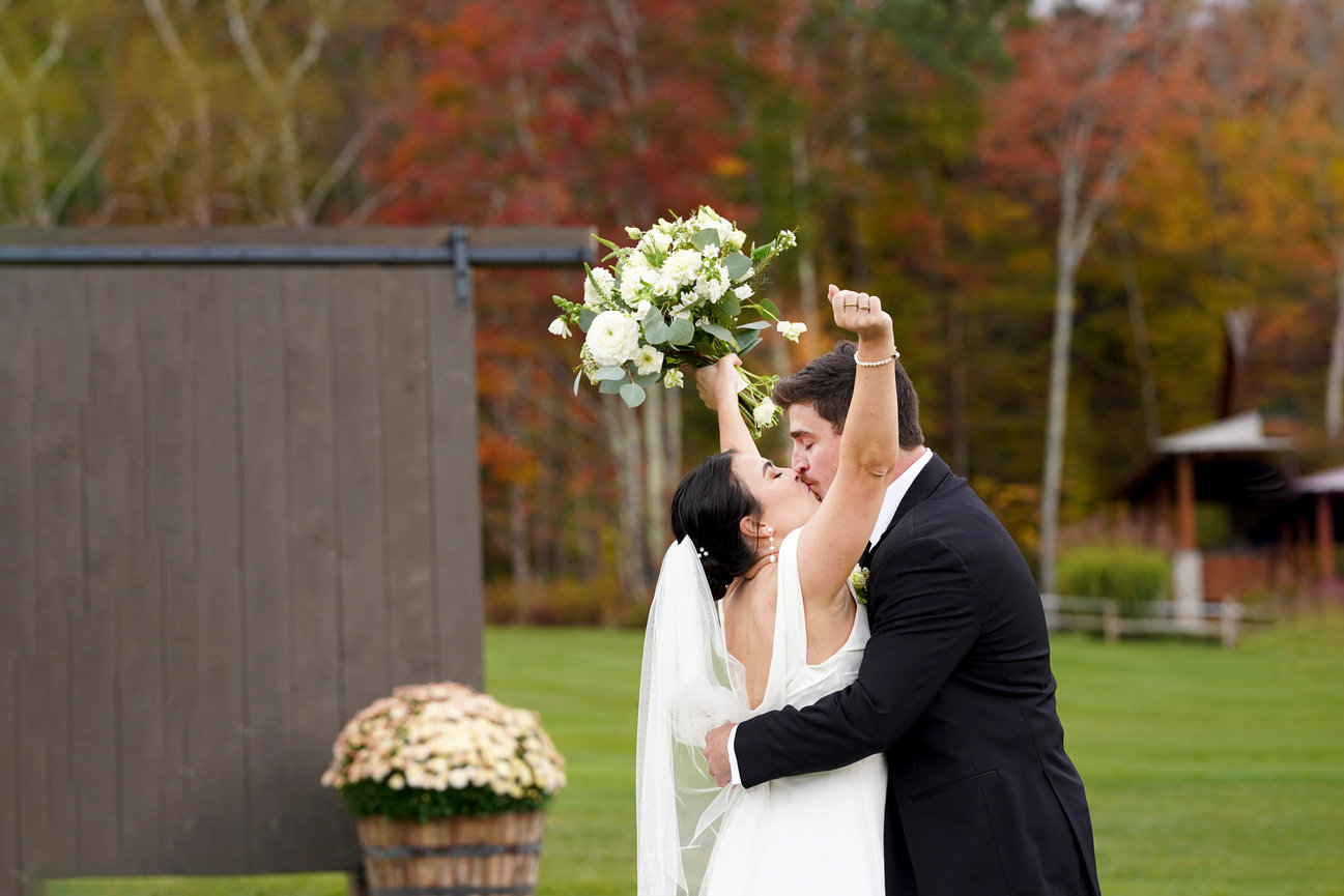 Bride and groom kissing after wedding ceremony at Mt. Top Resort