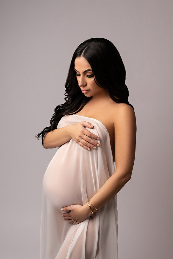 High-end maternity photo with draped silk and minimal styling, Monmouth County NJ