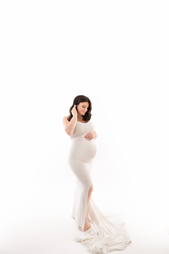 New Jersey maternity photographer captures expecting mother in studio with fine art styling