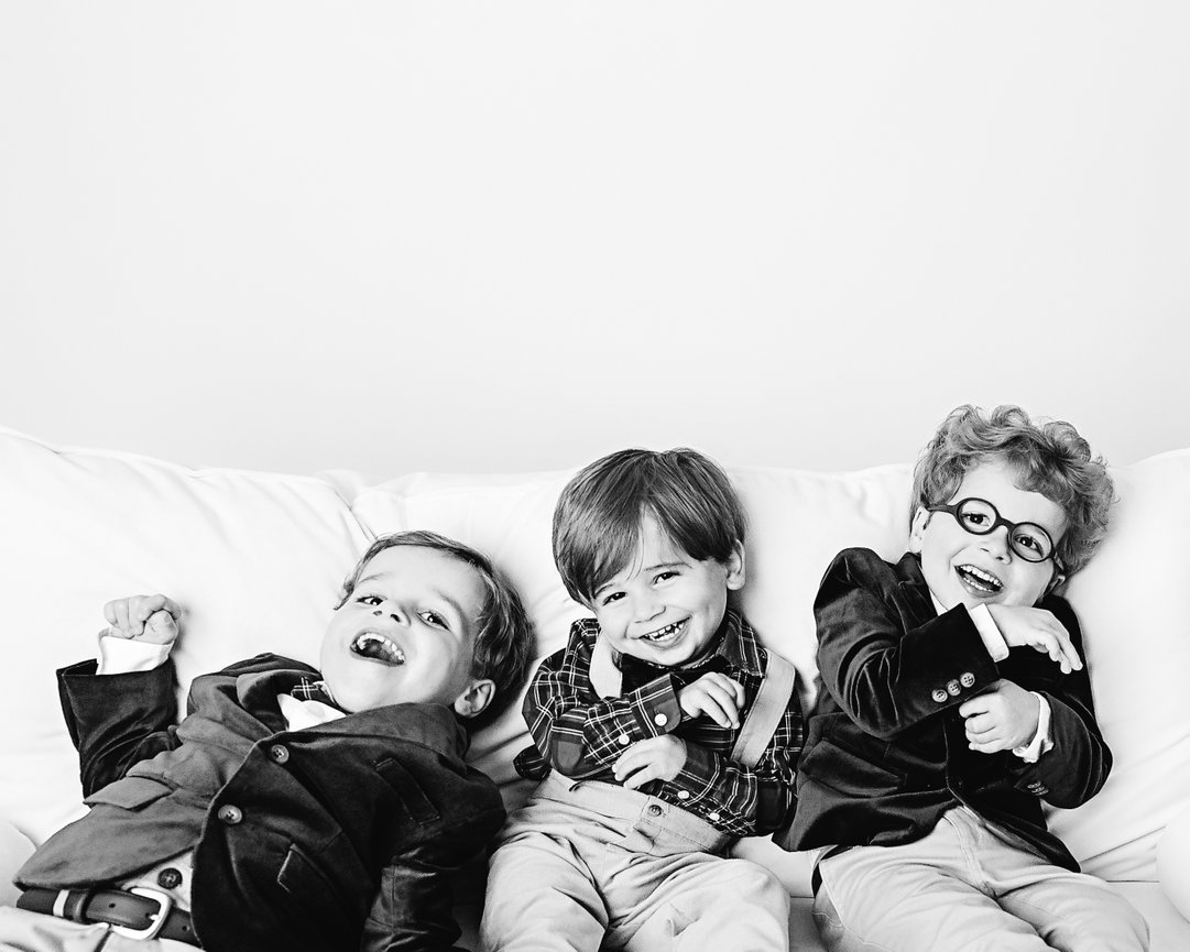 Cranbury kids sharing a silly moment on clean white set