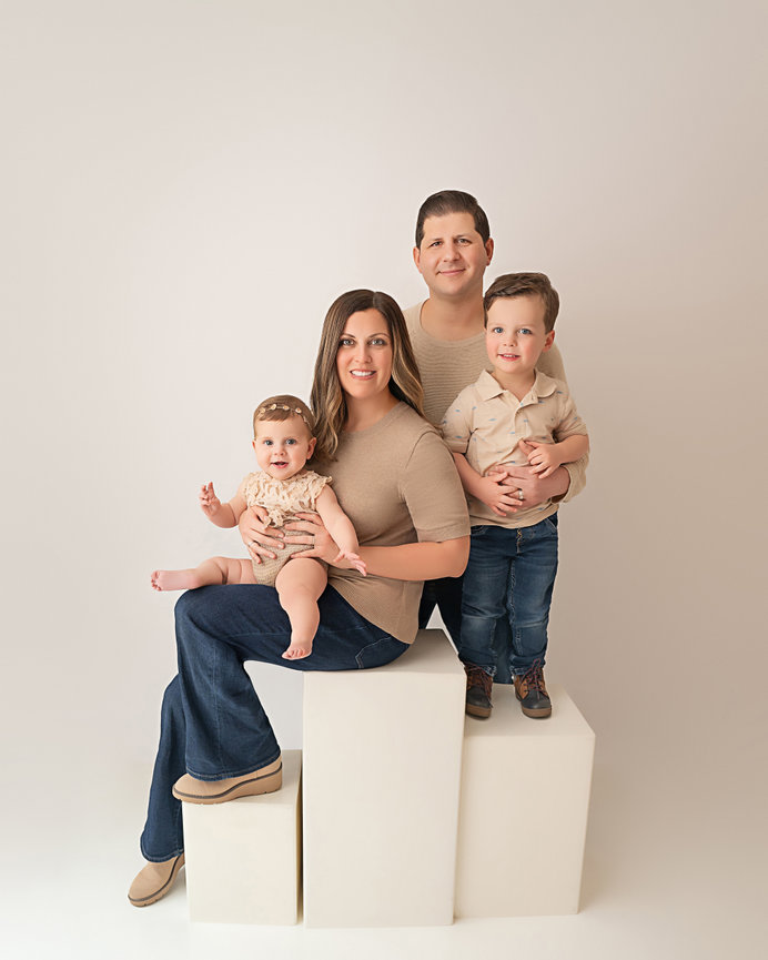 Studio portrait of Point Pleasant family in white space