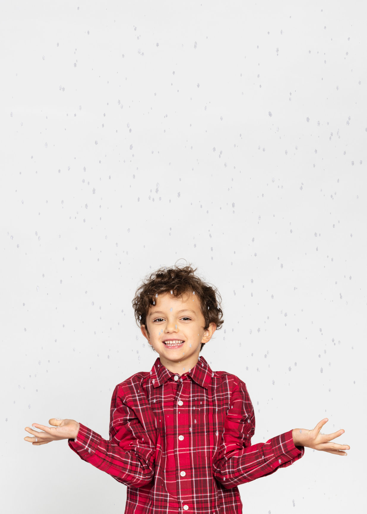 boy plays in the snow