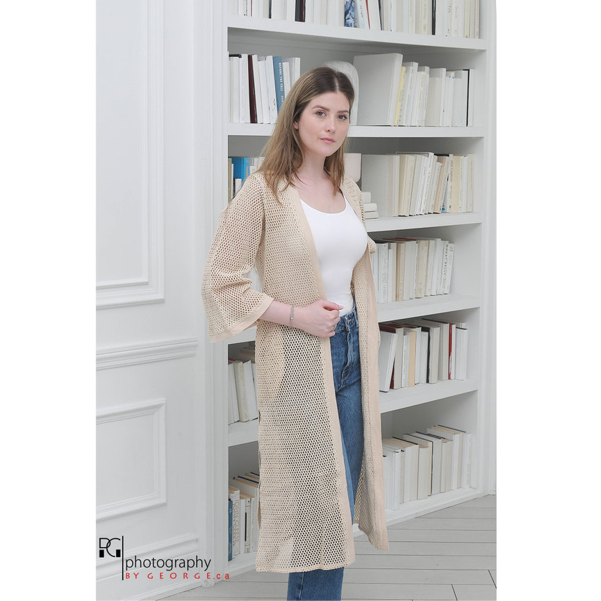 Model wearing a lightweight crochet cardigan over casual summer clothing, reflecting Summer 2026 fashion trends.