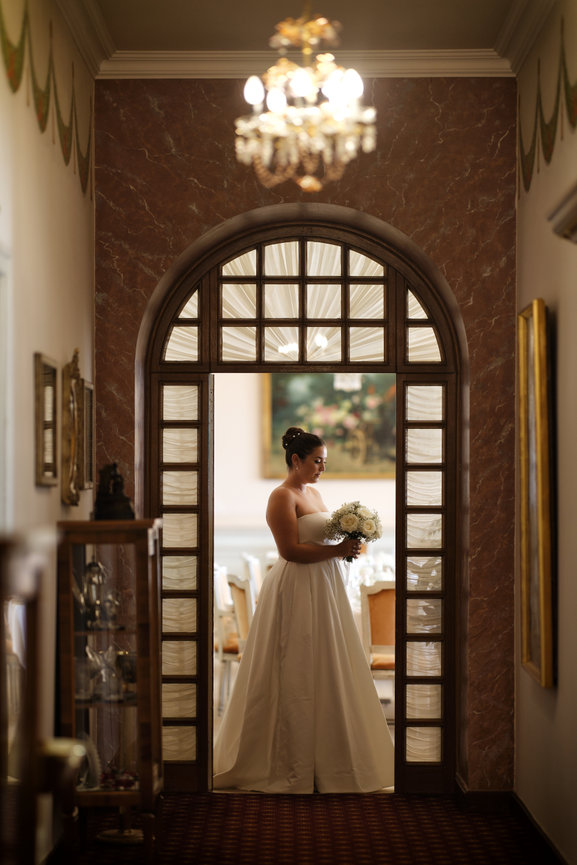 Bride standing in the elegant interior of Hotel Victoria in Montreux, Switzerland