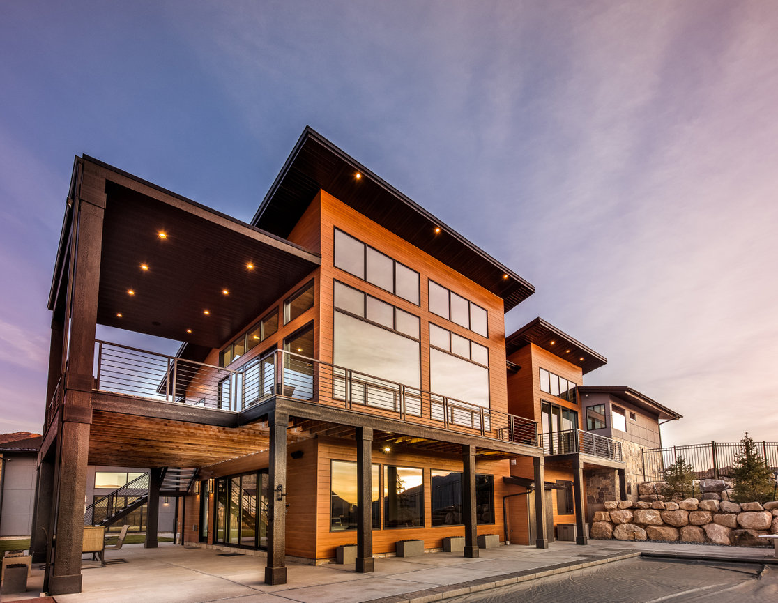 Architectural photo of a custom home with large windows.