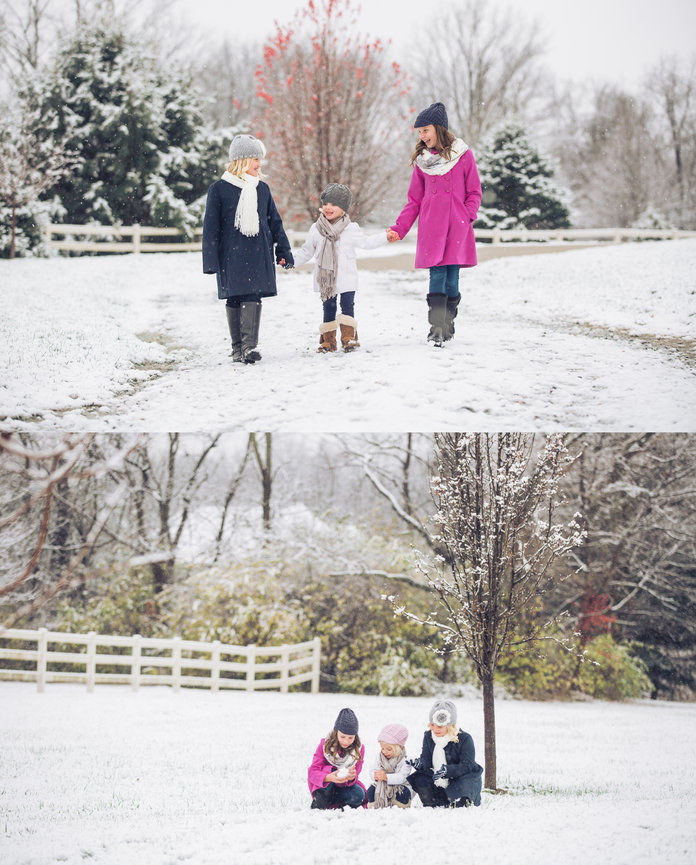 Three people walk in the snow holding hands, then sit under a tree, enjoying the snowy landscape and each others company.