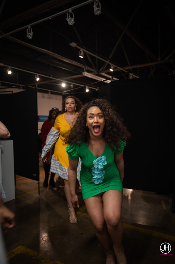 Jo Hayes Images Fashion Photographer great job capturing the true essence as model excitedly exits the runway charlotte event photography a fashion show female model a candid moment in Concord North Carolina